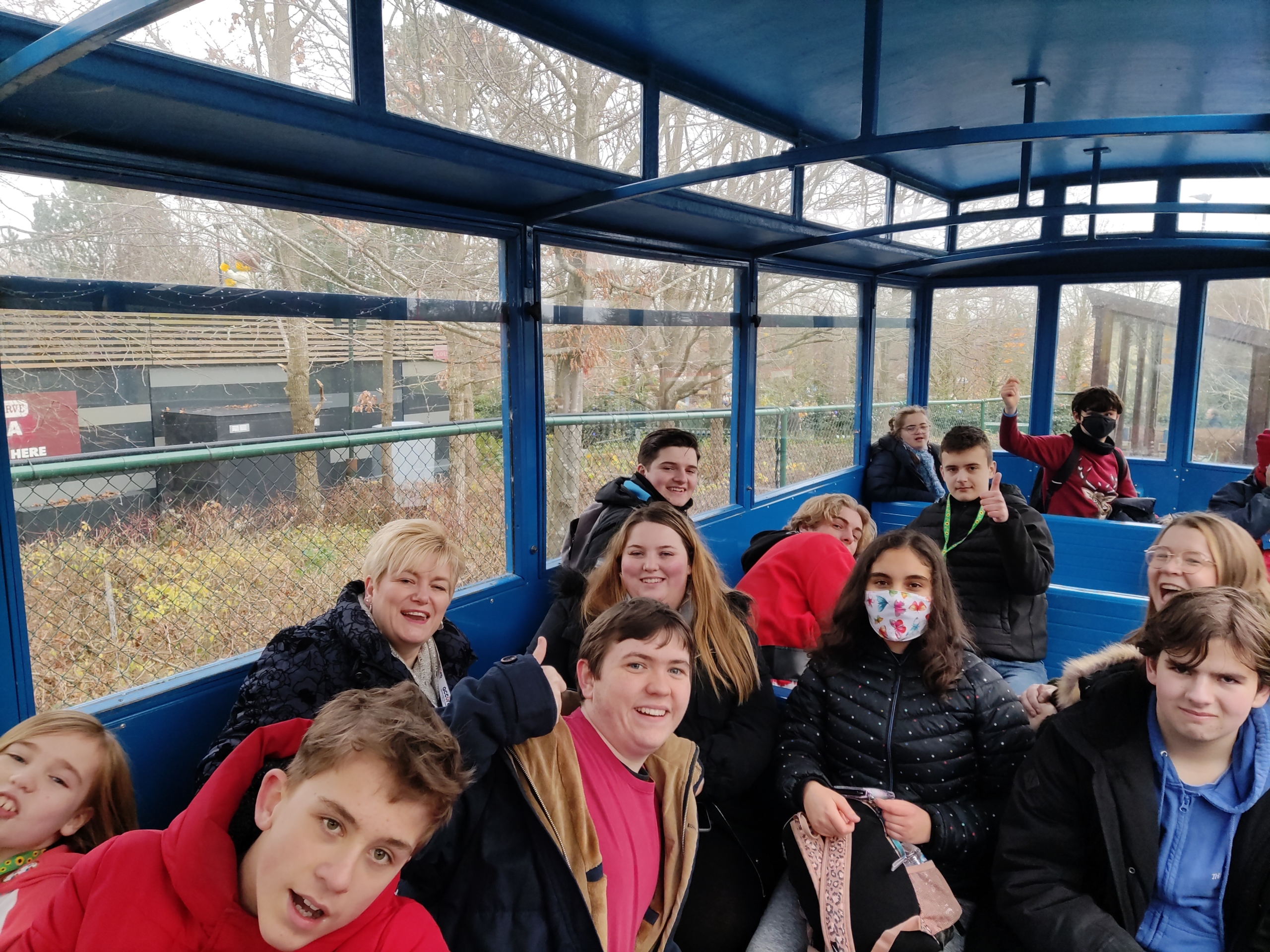 Accuro members smiling at the camera on a train ride at Legoland