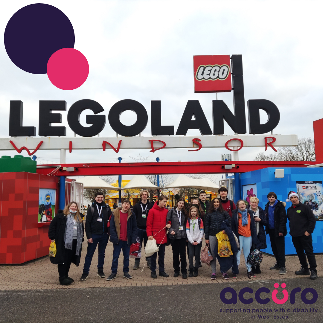 Accuro Staff and Members standing under the Legoland Windsor Sign