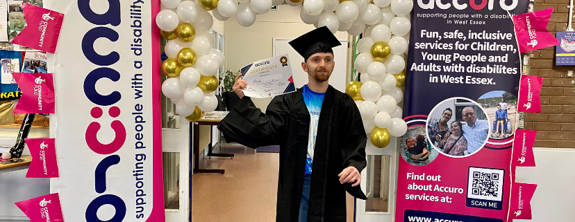 STRIDE Member in a Graduation Cap and Gown holding his certificate