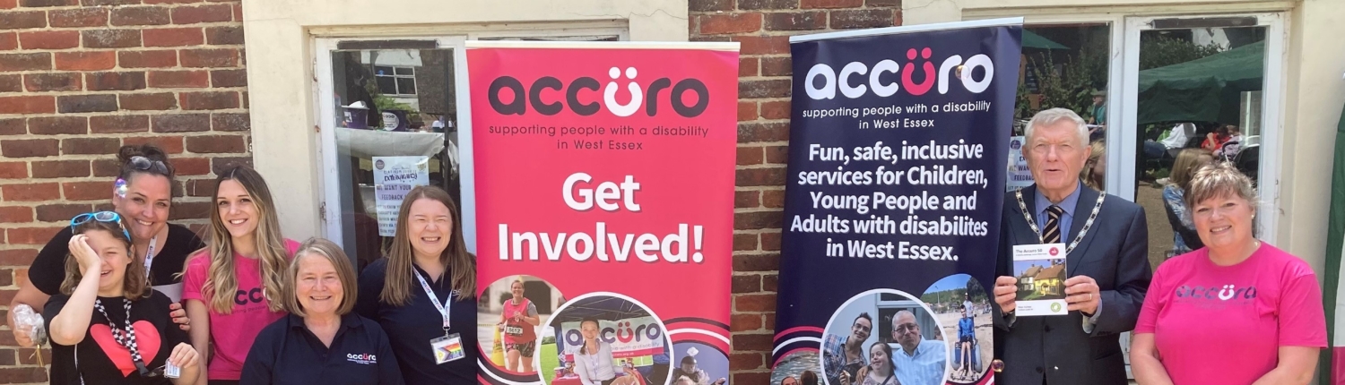 Accuro employees and volunteers with advertising stands for volunteers.