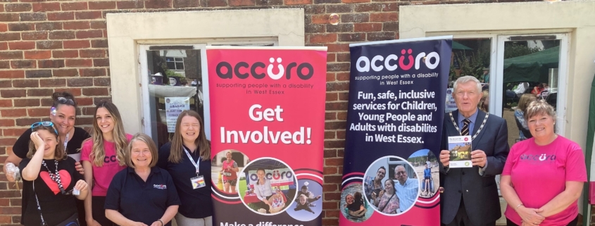 Accuro employees and volunteers with advertising stands for volunteers.