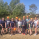 Accuro employees and staff wearing hard hats for outdoor activities.