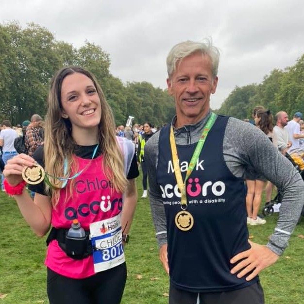 Chloe and Mark with their medals from a previous race.