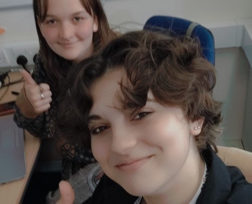 Poppy and Teagan giving Accuro a thumbs up.