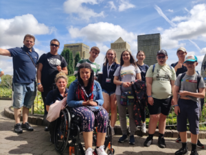 A group of Accuro staff and service users in London in the sunshine.